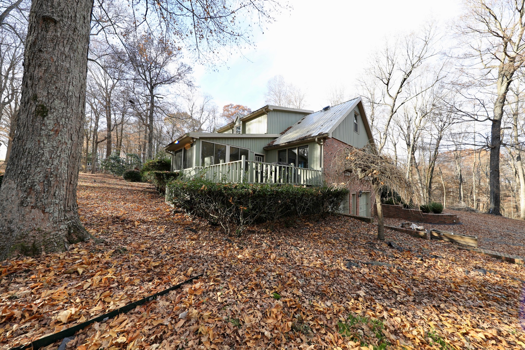 6982 New Chapel Road Springfield, TN 37172 - Photo 26 of 32 a house that has a tree in front of it