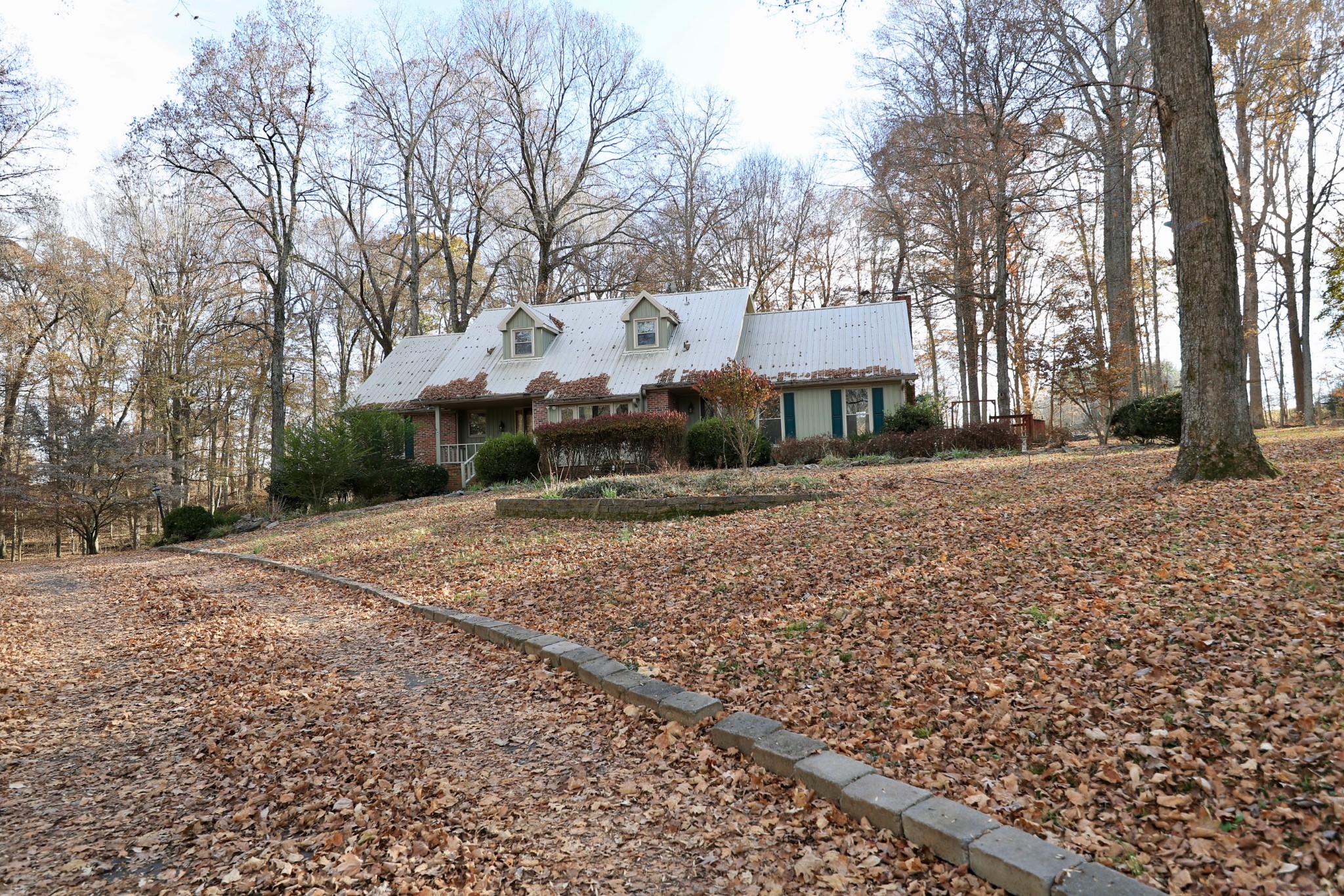 6982 New Chapel Road Springfield, TN 37172 - Photo 30 of 32 a front view of a house with a yard and garage