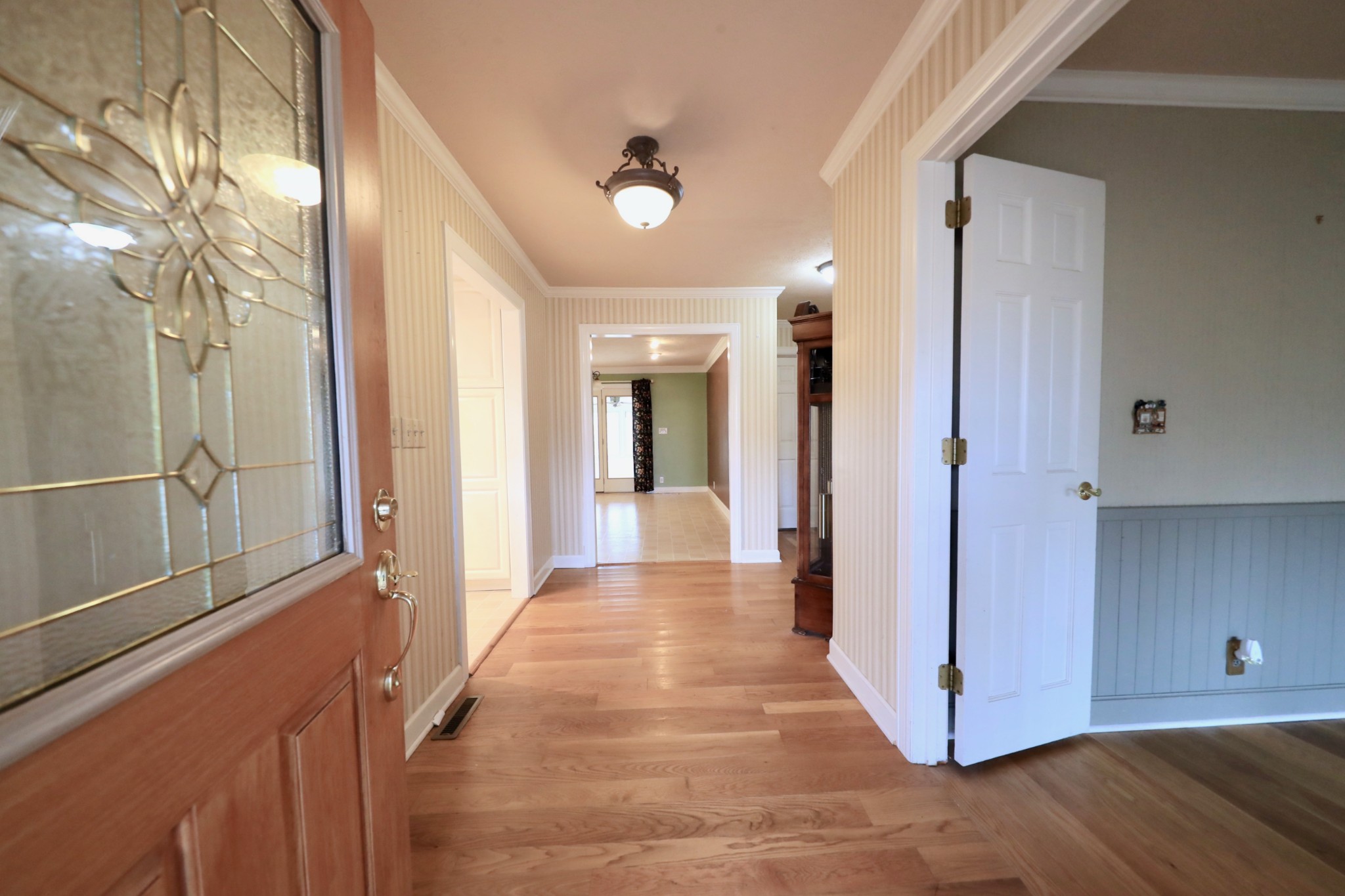 6982 New Chapel Road Springfield, TN 37172 - Photo 6 of 32 a view of a hallway with wooden floor and staircase