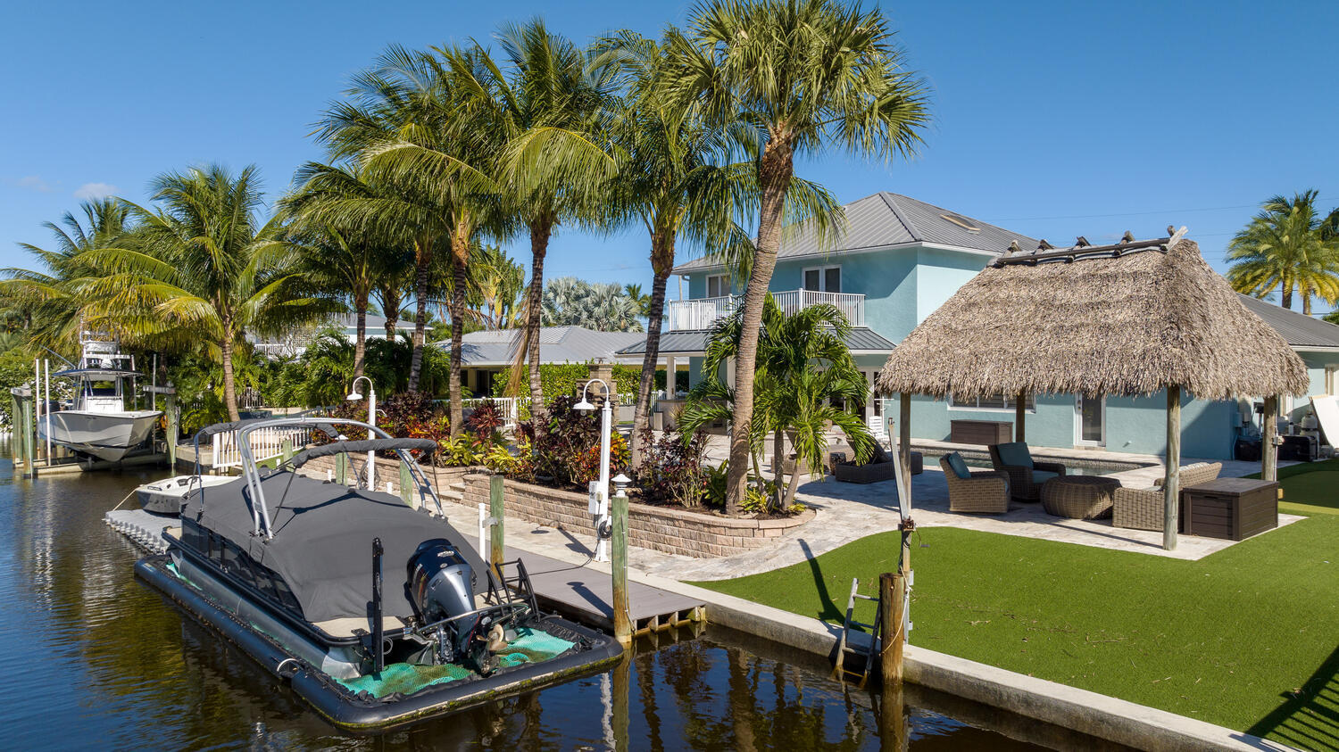 916 Dolphin Drive Jupiter, FL 33458 - Photo 36 of 64 Dock and Backyard