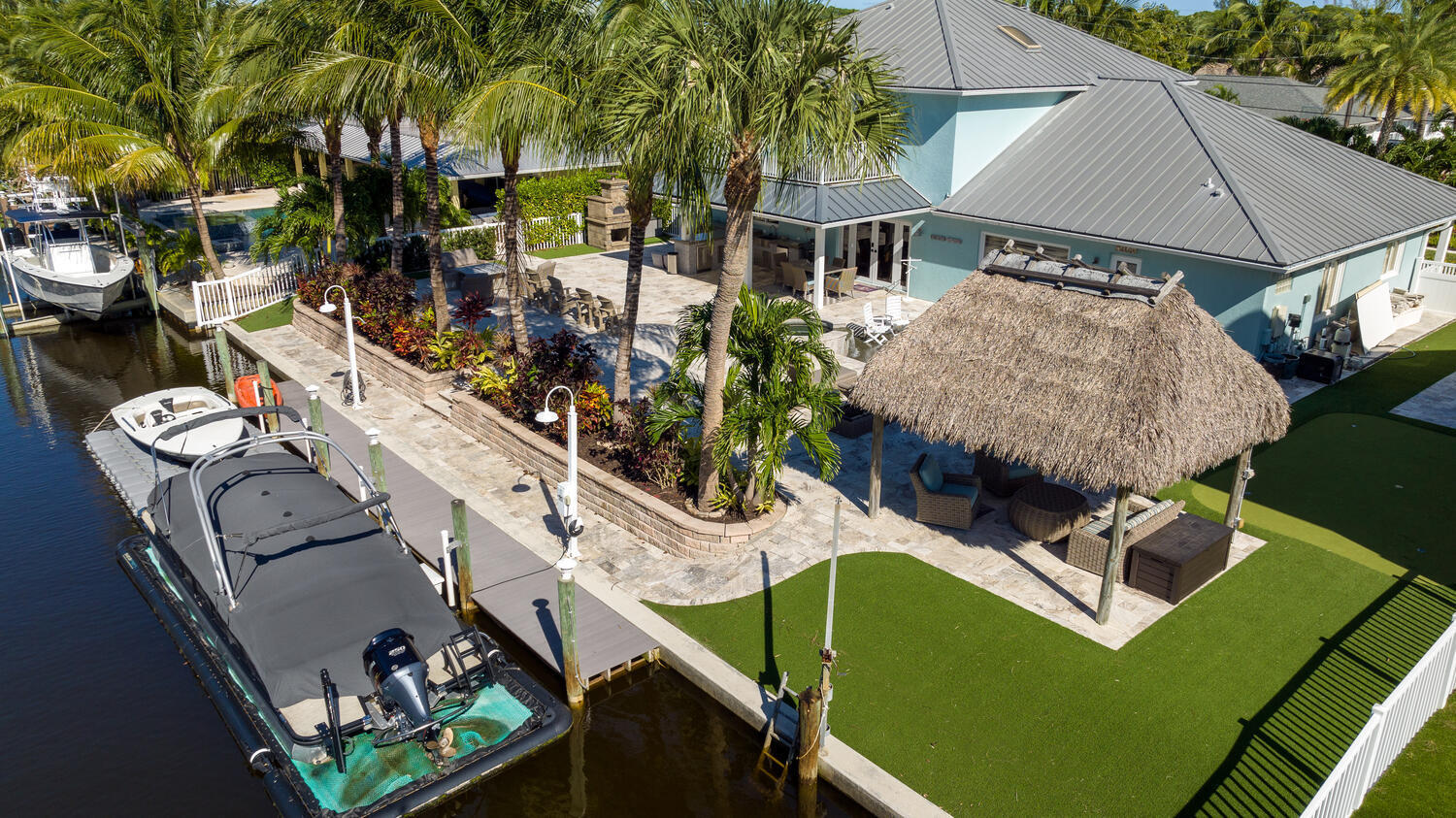 916 Dolphin Drive Jupiter, FL 33458 - Photo 37 of 64 Dock and Backyard