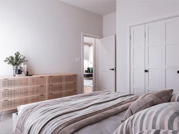 a bedroom with bed and a window