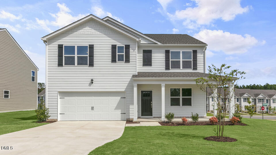 1281 Pavo Path Wendell, NC 27591 - Photo 1 of 54 a front view of white house with a yard