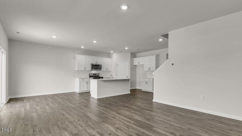 1281 Pavo Path Wendell, NC 27591 - Photo 15 of 54 a view of kitchen with wooden floor and electronic appliances