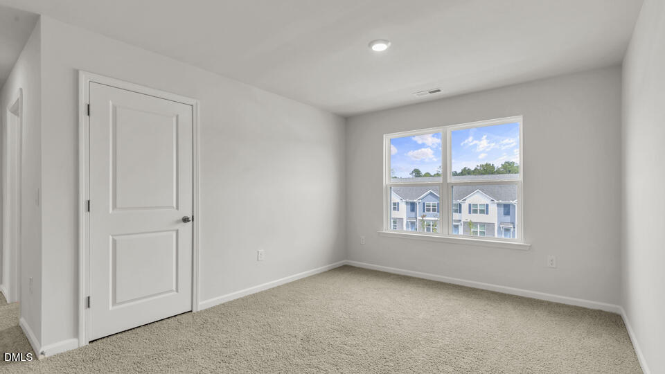 1281 Pavo Path Wendell, NC 27591 - Photo 18 of 54 a view of an empty room with a window