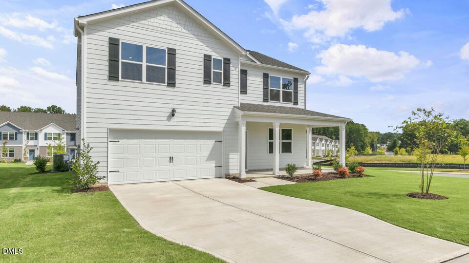 1281 Pavo Path Wendell, NC 27591 - Photo 2 of 54 a front view of a house with a yard and trees