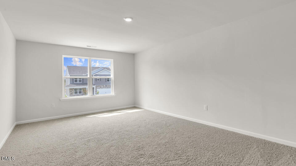 1281 Pavo Path Wendell, NC 27591 - Photo 21 of 54 an empty room with windows