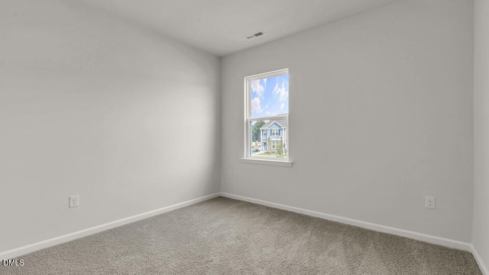 1281 Pavo Path Wendell, NC 27591 - Photo 27 of 54 a view of an empty room with a window