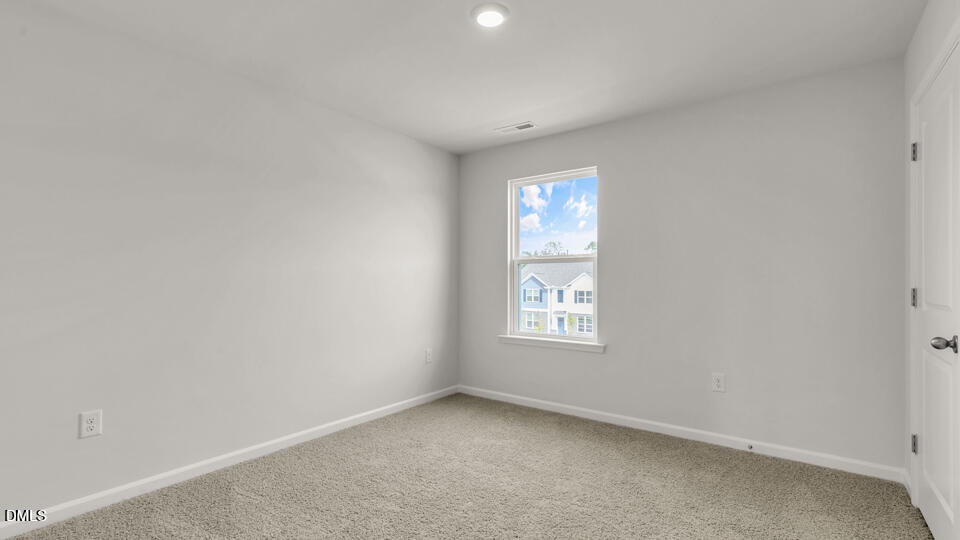 1281 Pavo Path Wendell, NC 27591 - Photo 29 of 54 an empty room with windows