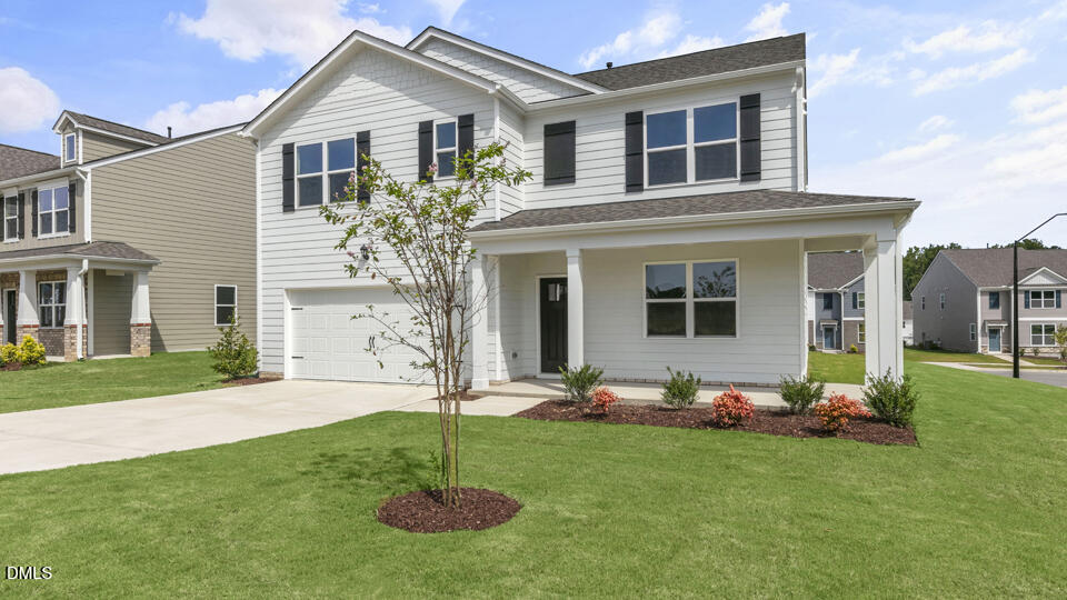 1281 Pavo Path Wendell, NC 27591 - Photo 3 of 54 a front view of house with a garden and patio