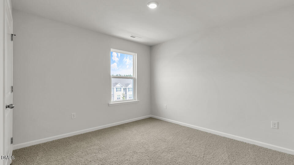 1281 Pavo Path Wendell, NC 27591 - Photo 31 of 54 an empty room with a window