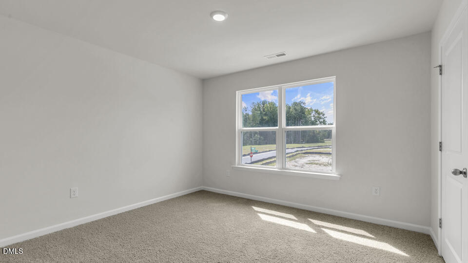 1281 Pavo Path Wendell, NC 27591 - Photo 33 of 54 an empty room with windows