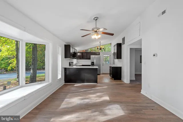 a view of a kitchen with a sink and a window