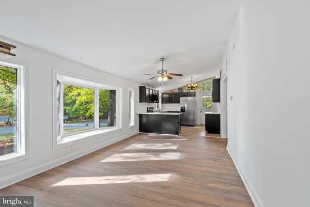 a kitchen with stainless steel appliances granite countertop a stove and a refrigerator