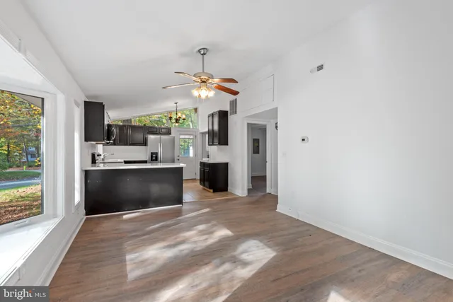 a view of a kitchen with a sink and dishwasher with kitchen view