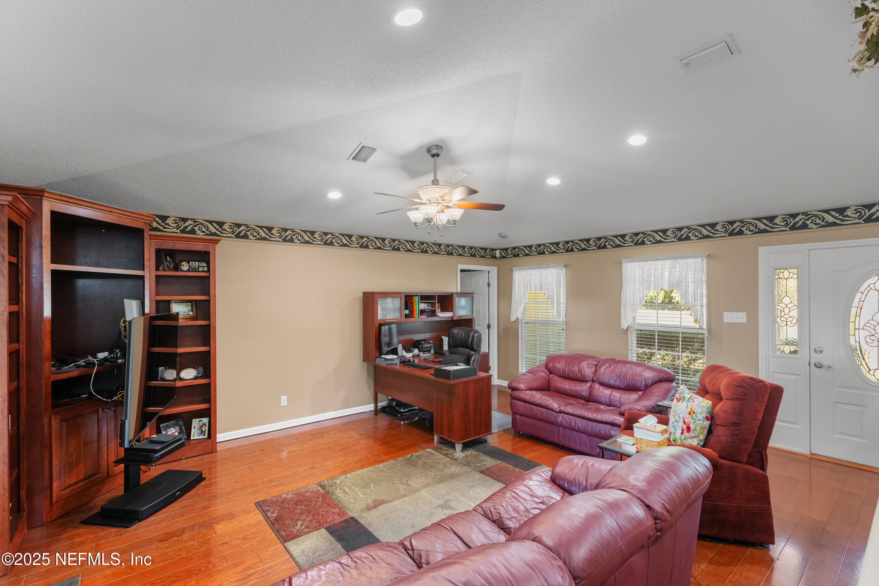 618 Southeast 44th Street Keystone Heights, FL 32656 - Photo 26 of 66 a living room with furniture and a chandelier