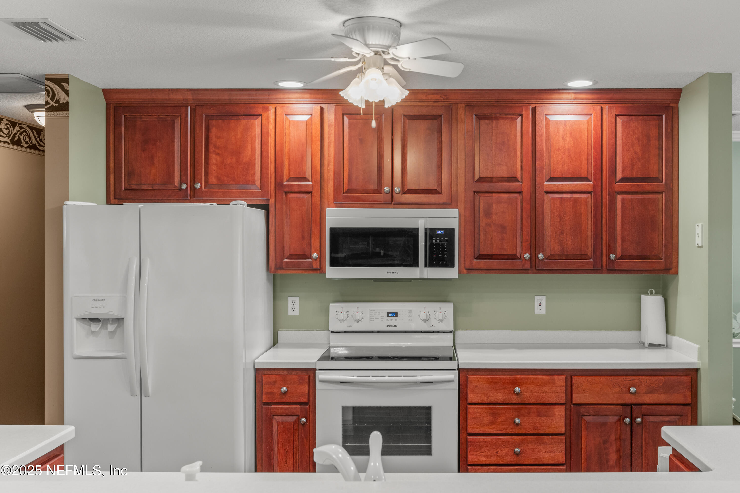 618 Southeast 44th Street Keystone Heights, FL 32656 - Photo 29 of 66 a kitchen with stainless steel appliances granite countertop a refrigerator and a microwave