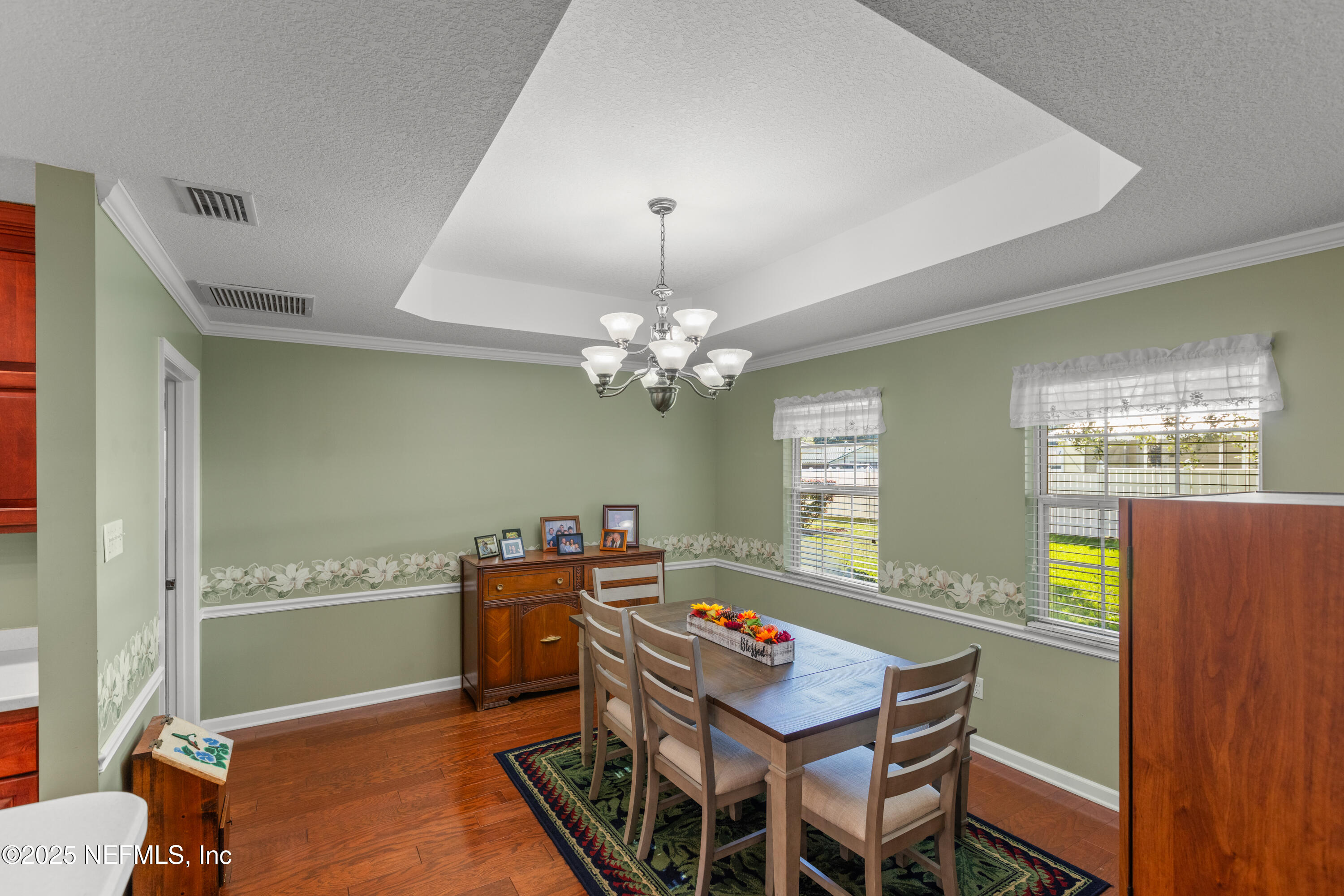 618 Southeast 44th Street Keystone Heights, FL 32656 - Photo 31 of 66 a room with chandelier fan and wooden furniture