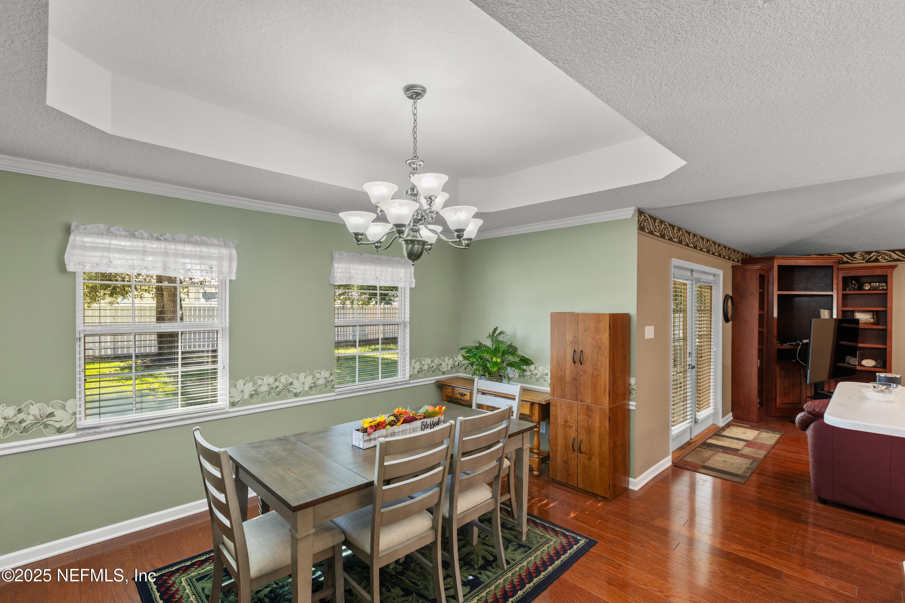 618 Southeast 44th Street Keystone Heights, FL 32656 - Photo 33 of 66 a view of a dining room with furniture window and wooden floor