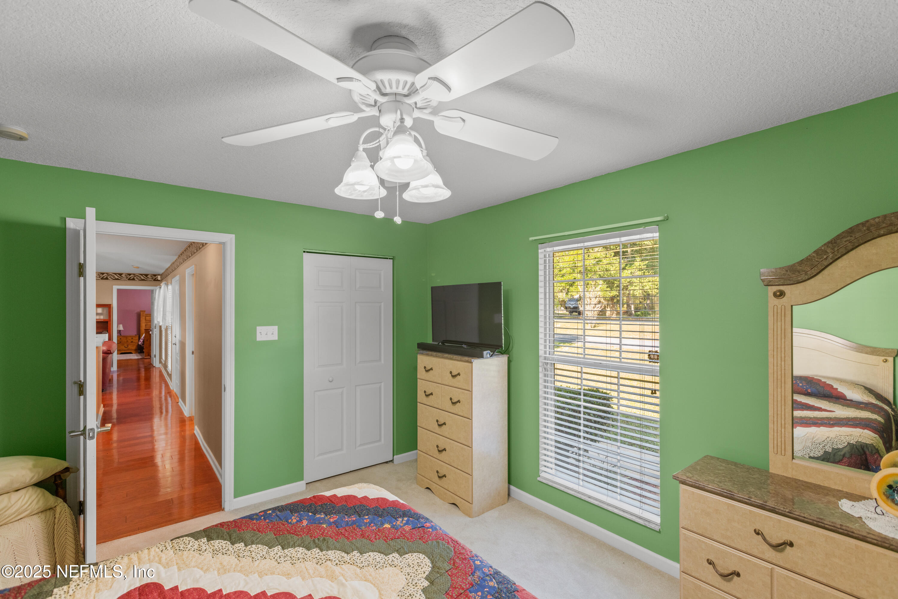 618 Southeast 44th Street Keystone Heights, FL 32656 - Photo 45 of 66 a view of a livingroom with a chandelier fan and a window