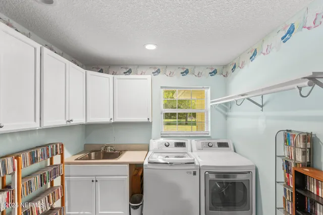 a living room with a large window and a table