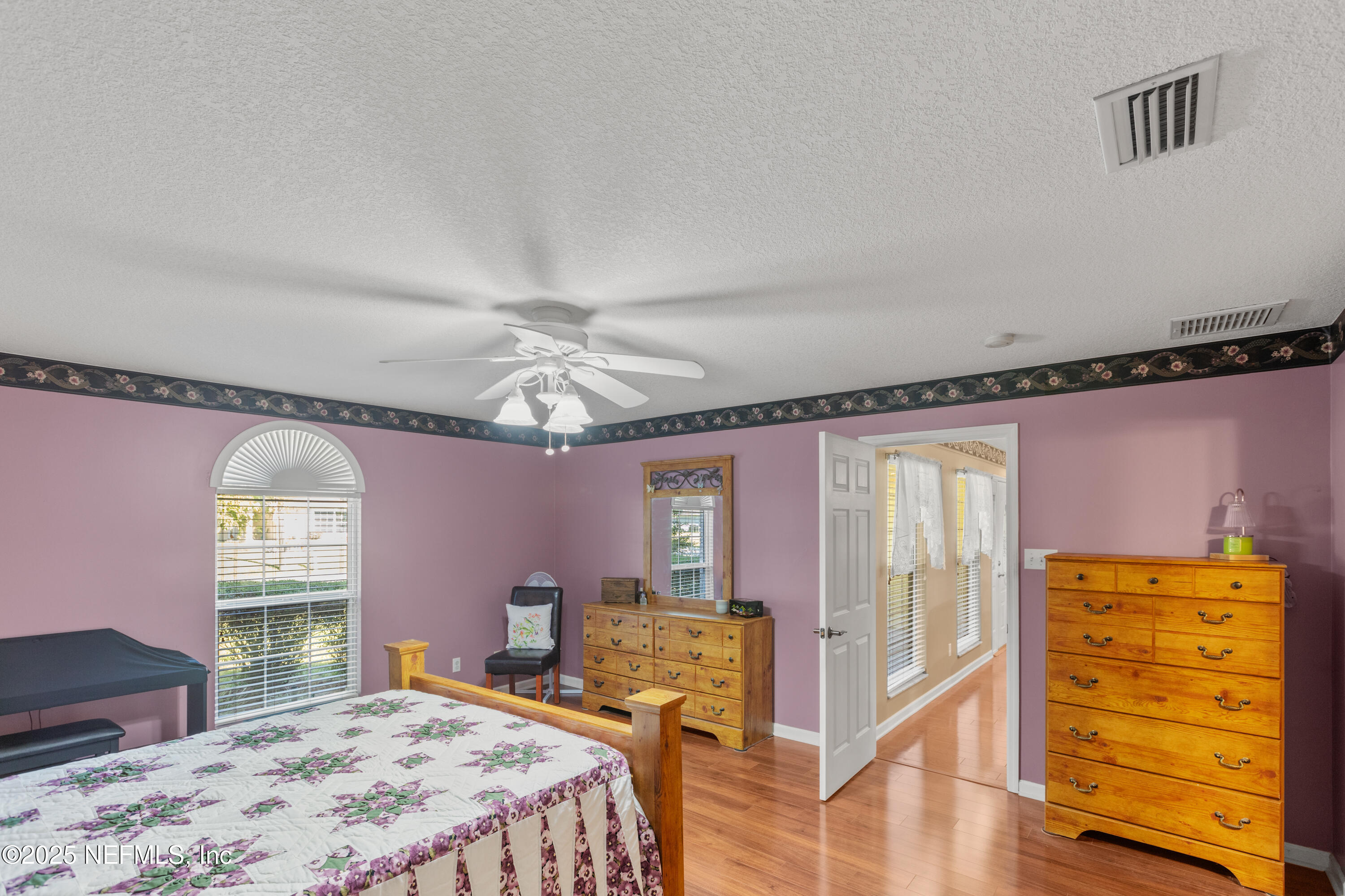 618 Southeast 44th Street Keystone Heights, FL 32656 - Photo 52 of 66 a bedroom with a bed and a dresser
