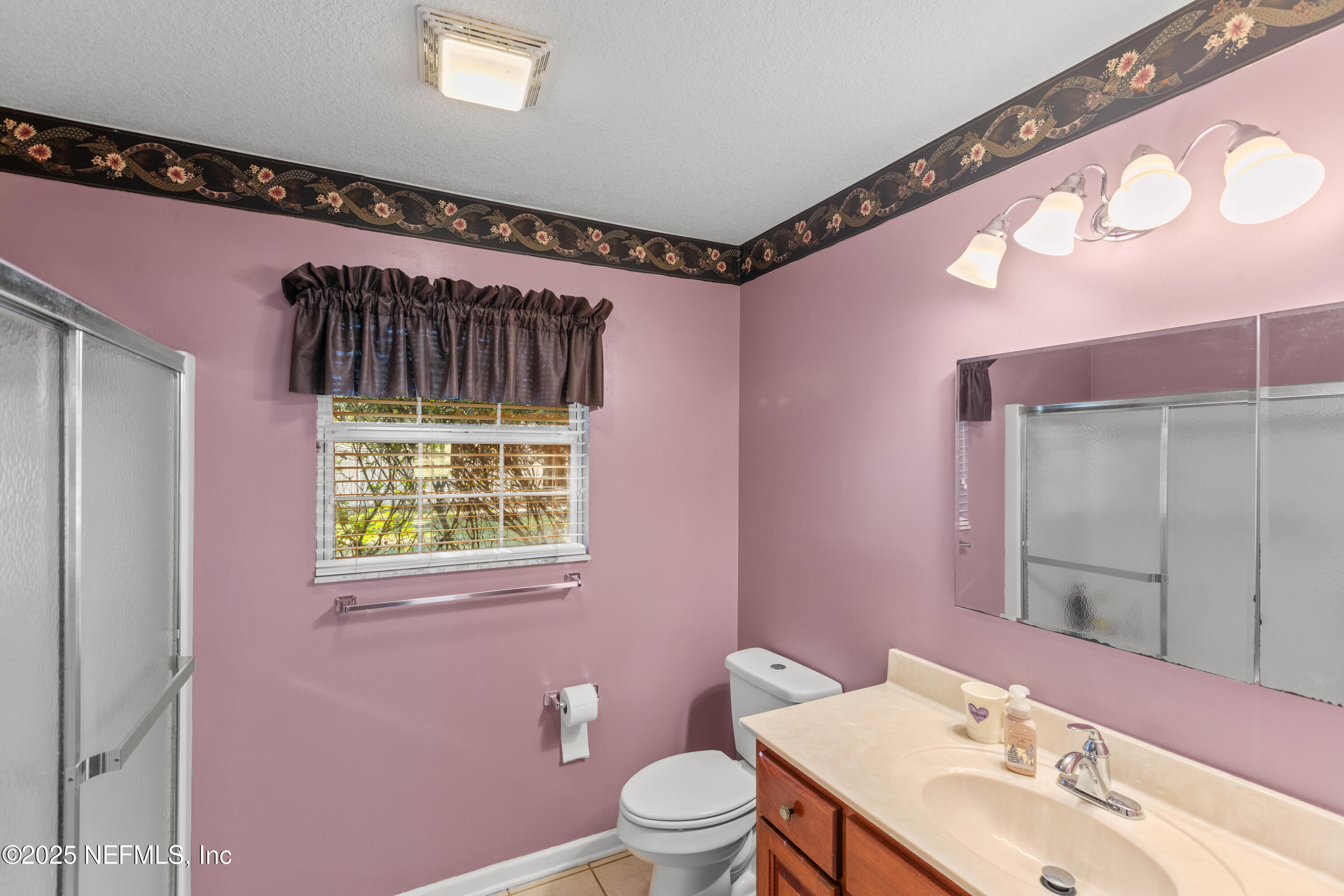 618 Southeast 44th Street Keystone Heights, FL 32656 - Photo 54 of 66 a bathroom with a sink a toilet and a mirror