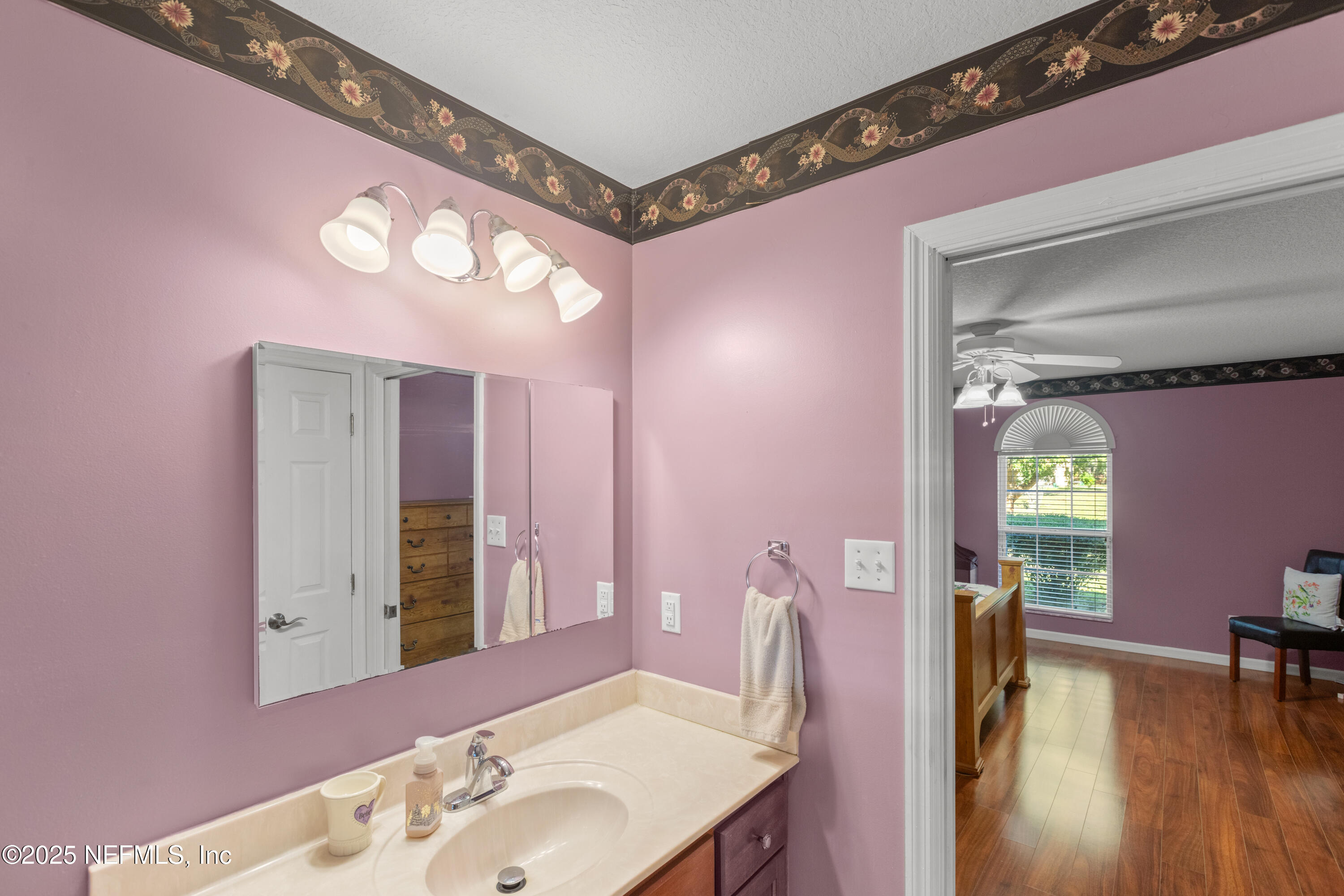 618 Southeast 44th Street Keystone Heights, FL 32656 - Photo 55 of 66 a bathroom with a sink a vanity and a mirror
