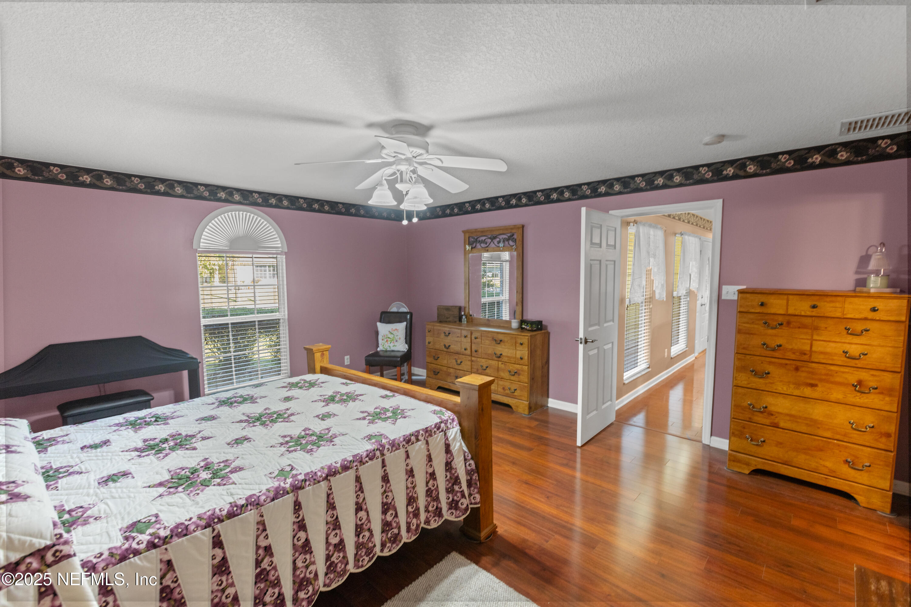 618 Southeast 44th Street Keystone Heights, FL 32656 - Photo 57 of 66 a bedroom with a bed and wooden floor