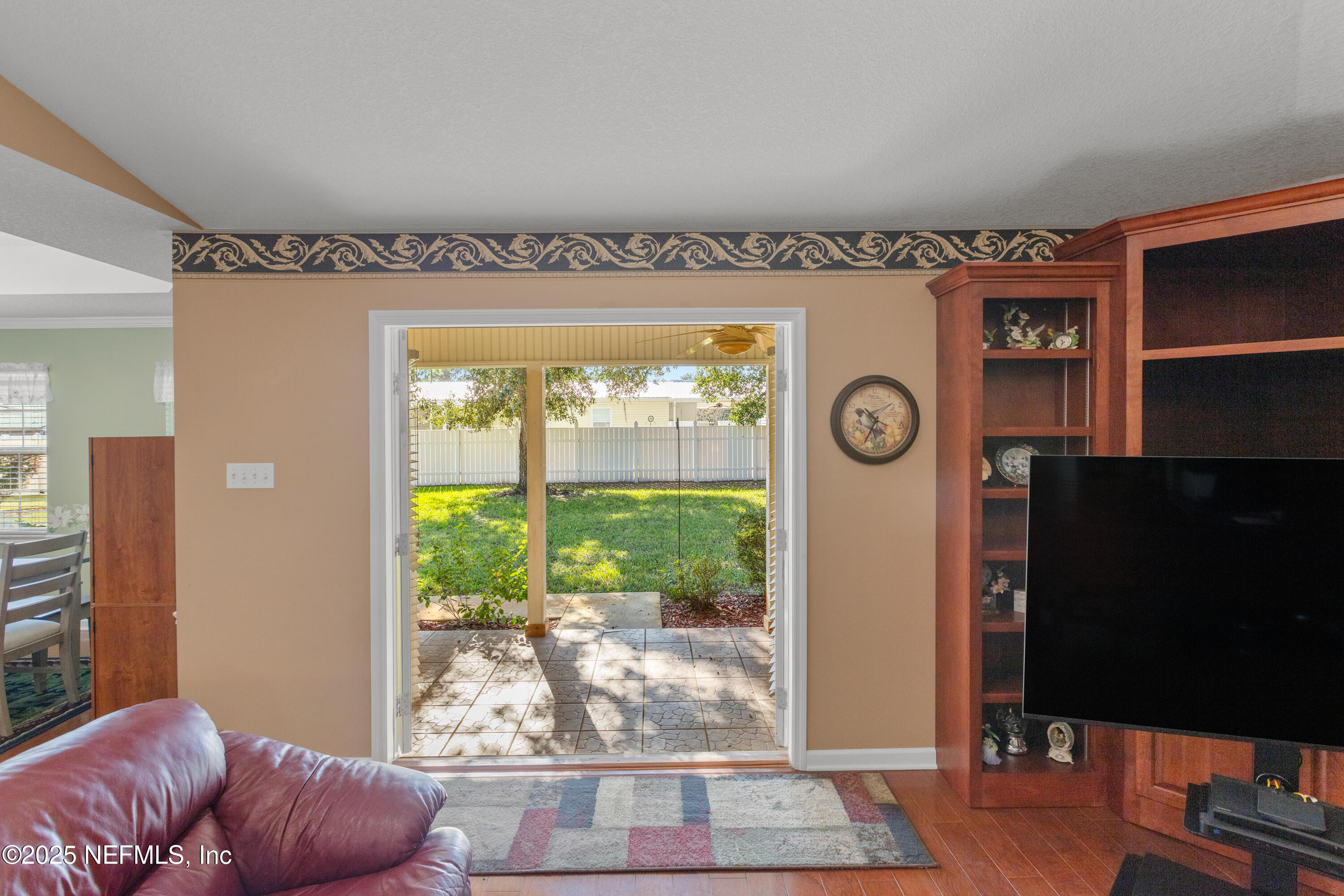 618 Southeast 44th Street Keystone Heights, FL 32656 - Photo 58 of 66 a living room with a large window and a table