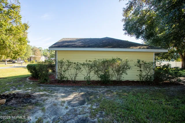 a front view of house with yard and outdoor seating