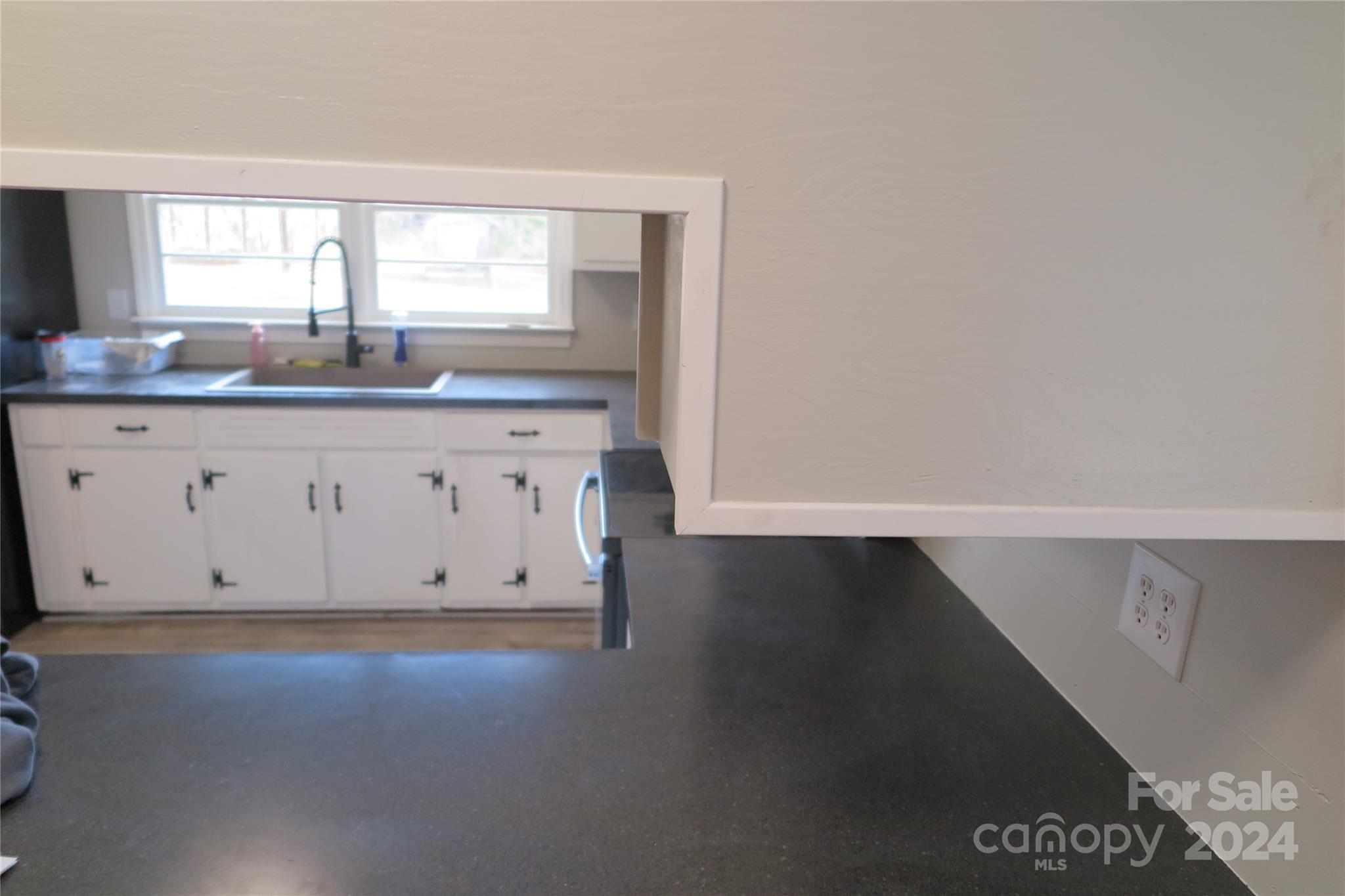 544 Loray Farm Road Dallas, NC 28034 - Photo 5 of 30 a view of kitchen with granite countertop sink and window