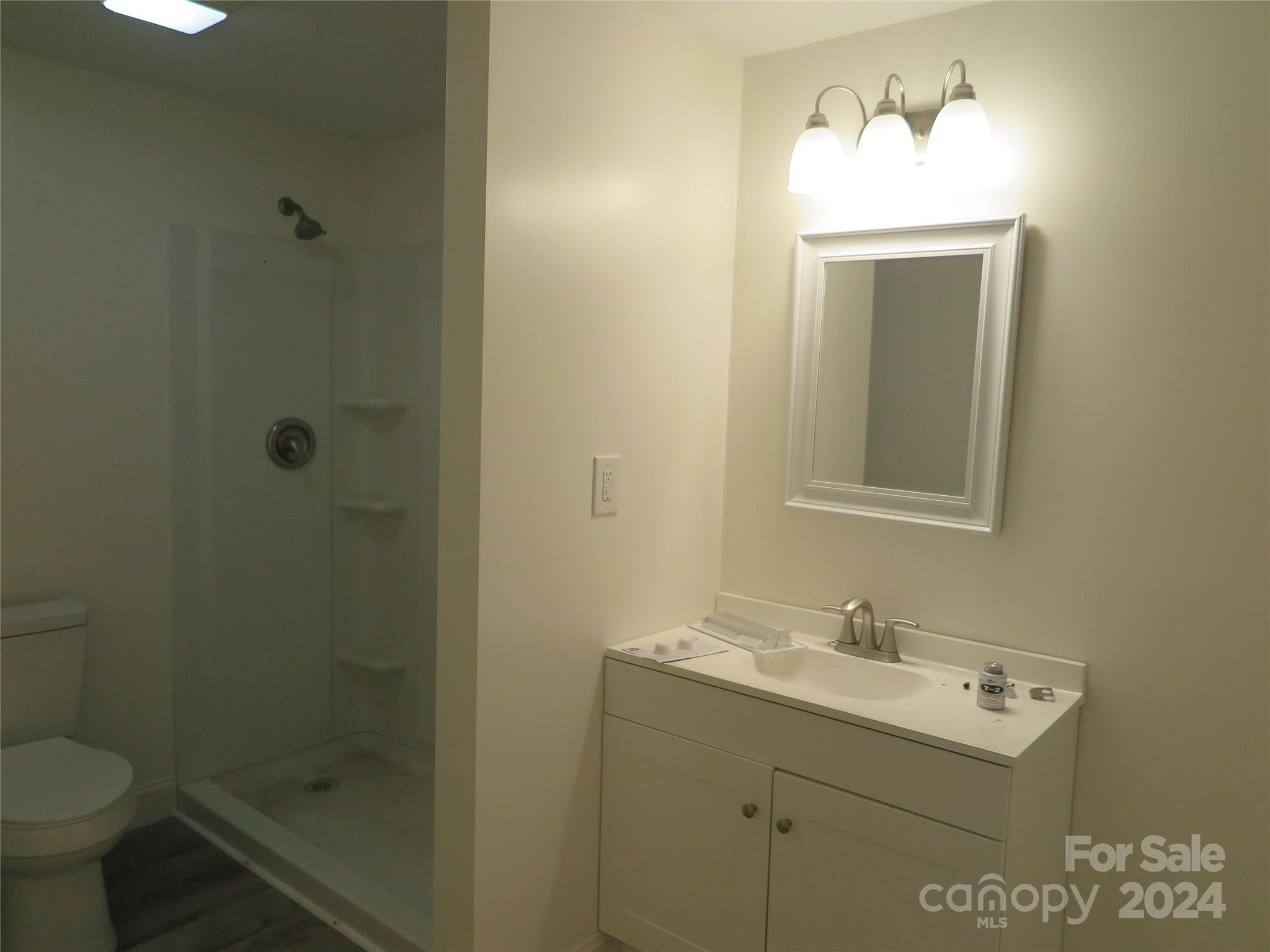 544 Loray Farm Road Dallas, NC 28034 - Photo 9 of 30 a bathroom with a sink toilet and shower