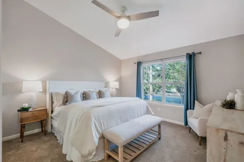 a bedroom with a bed and window