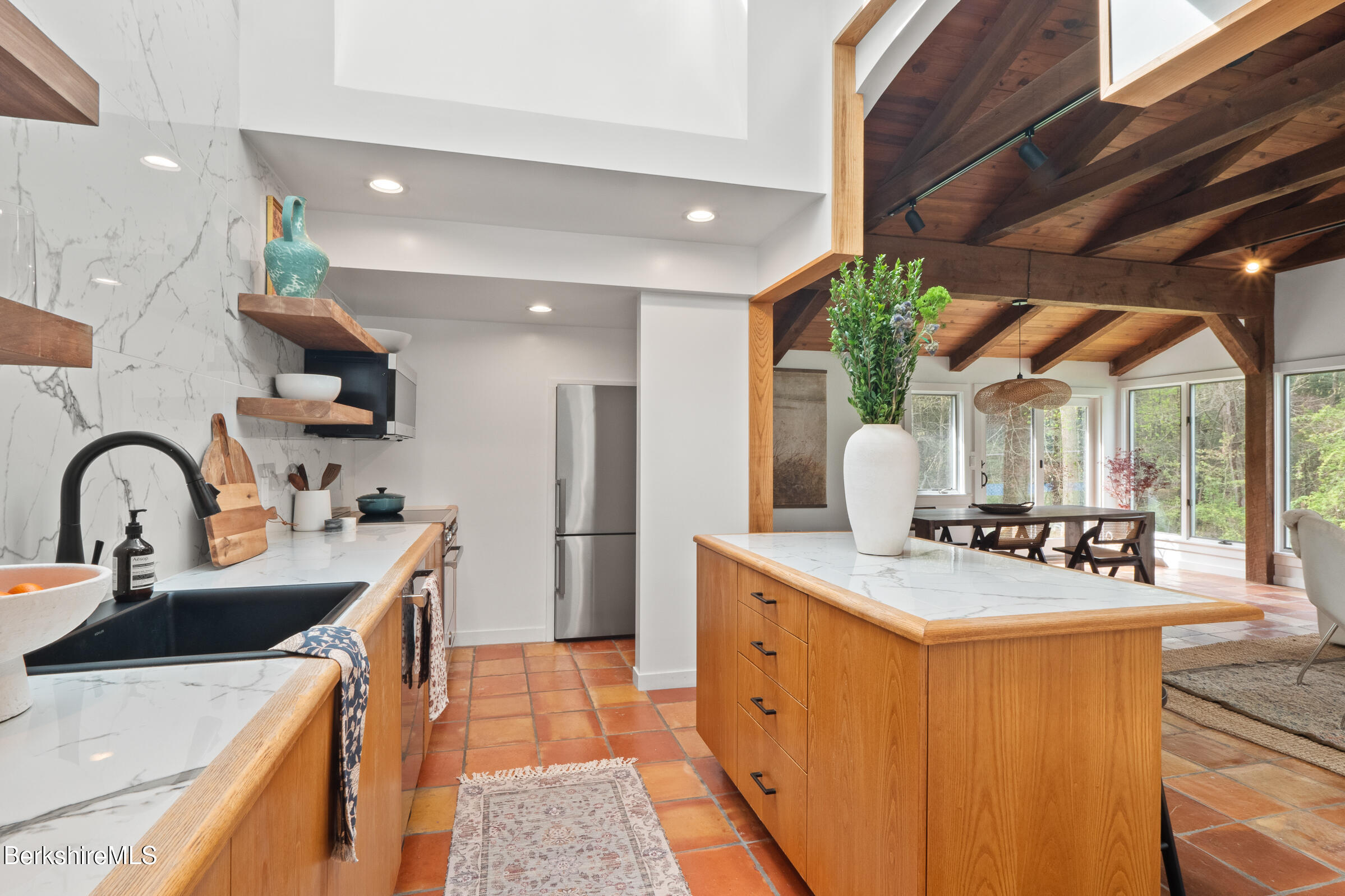 246 County Road Sheffield, MA 01257 - Photo 17 of 59 a kitchen with stainless steel appliances granite countertop a sink a stove and a refrigerator