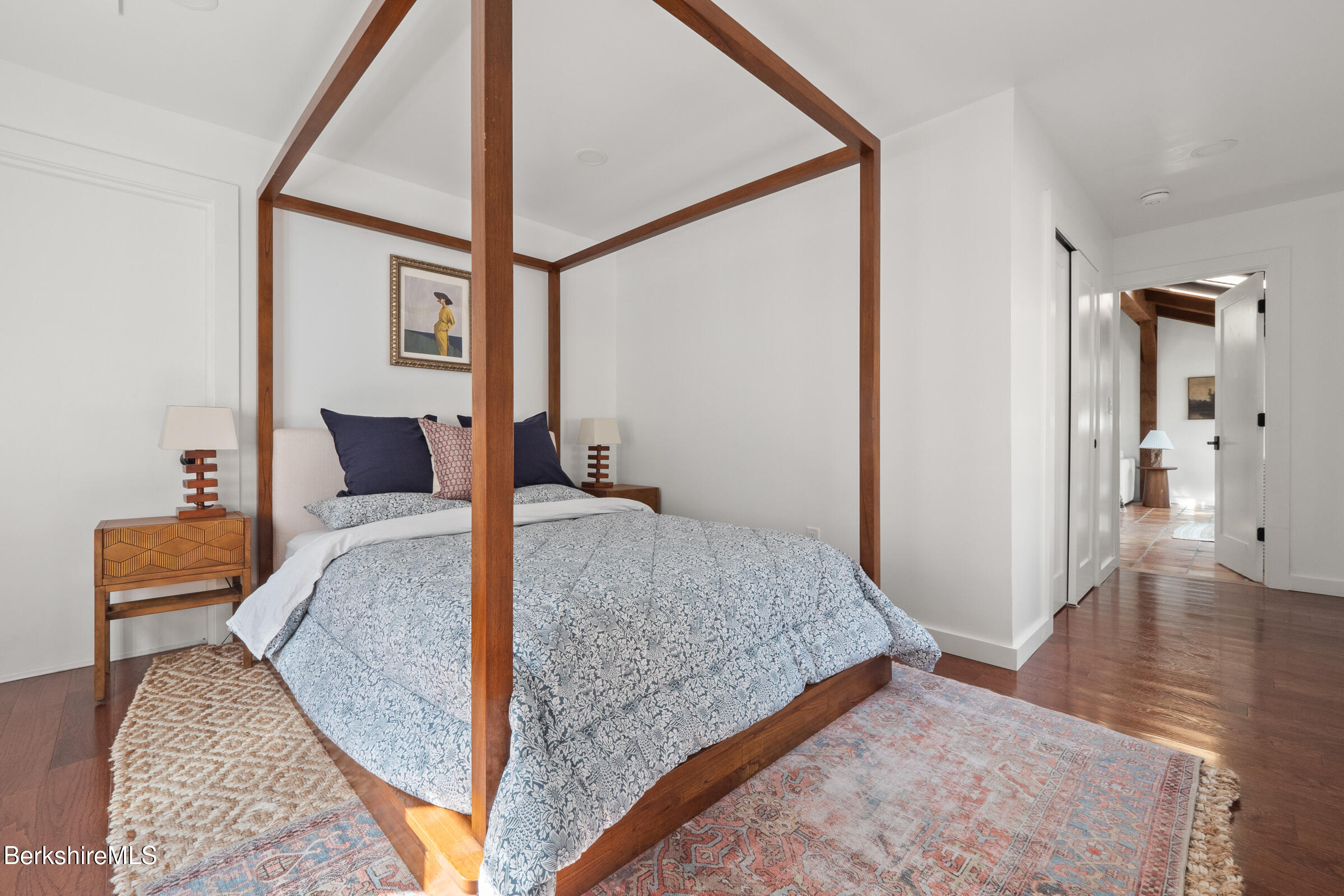 246 County Road Sheffield, MA 01257 - Photo 23 of 59 a bedroom with a bed and wooden floor