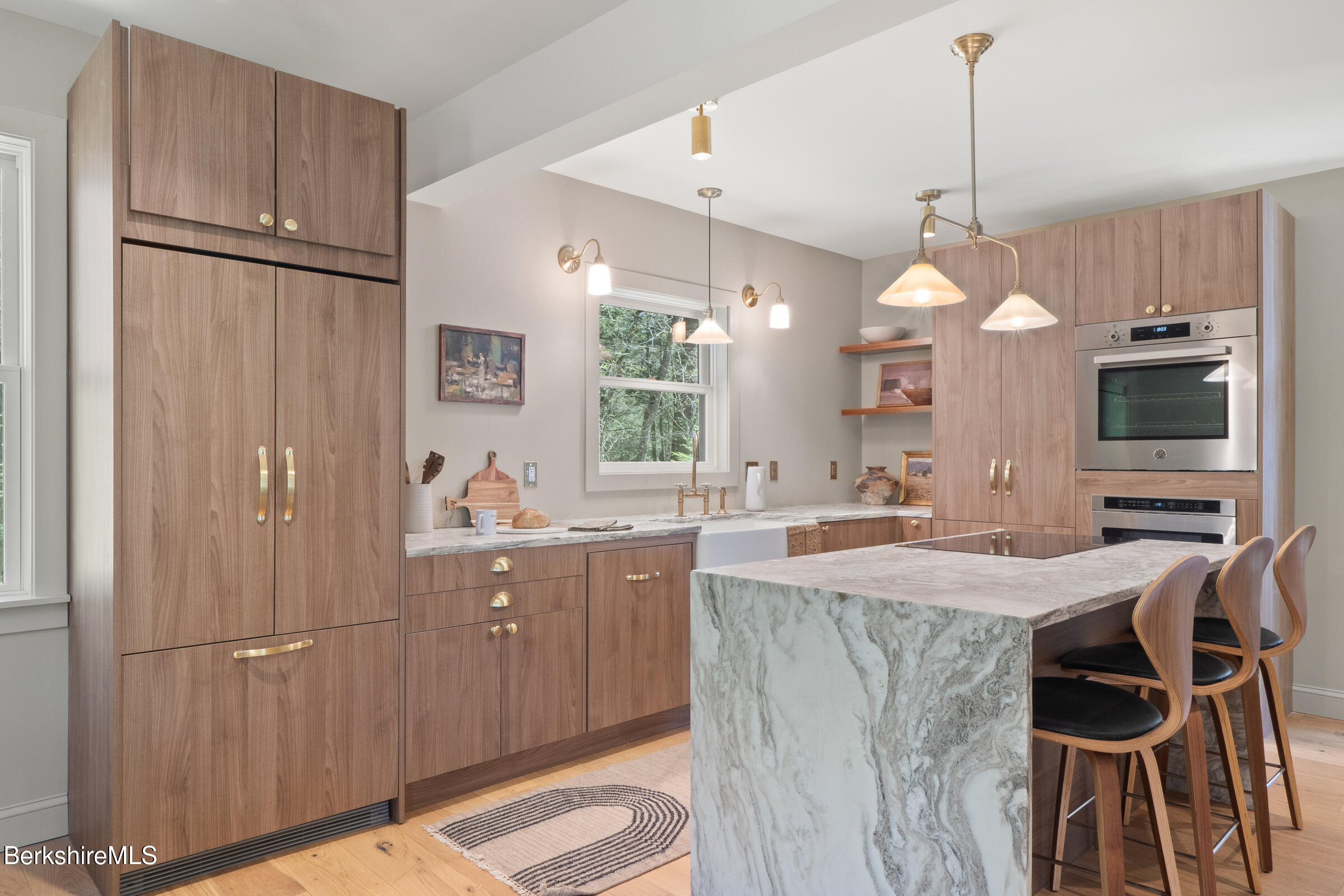 246 County Road Sheffield, MA 01257 - Photo 30 of 59 a kitchen with kitchen island granite countertop a sink a counter space appliances and cabinets