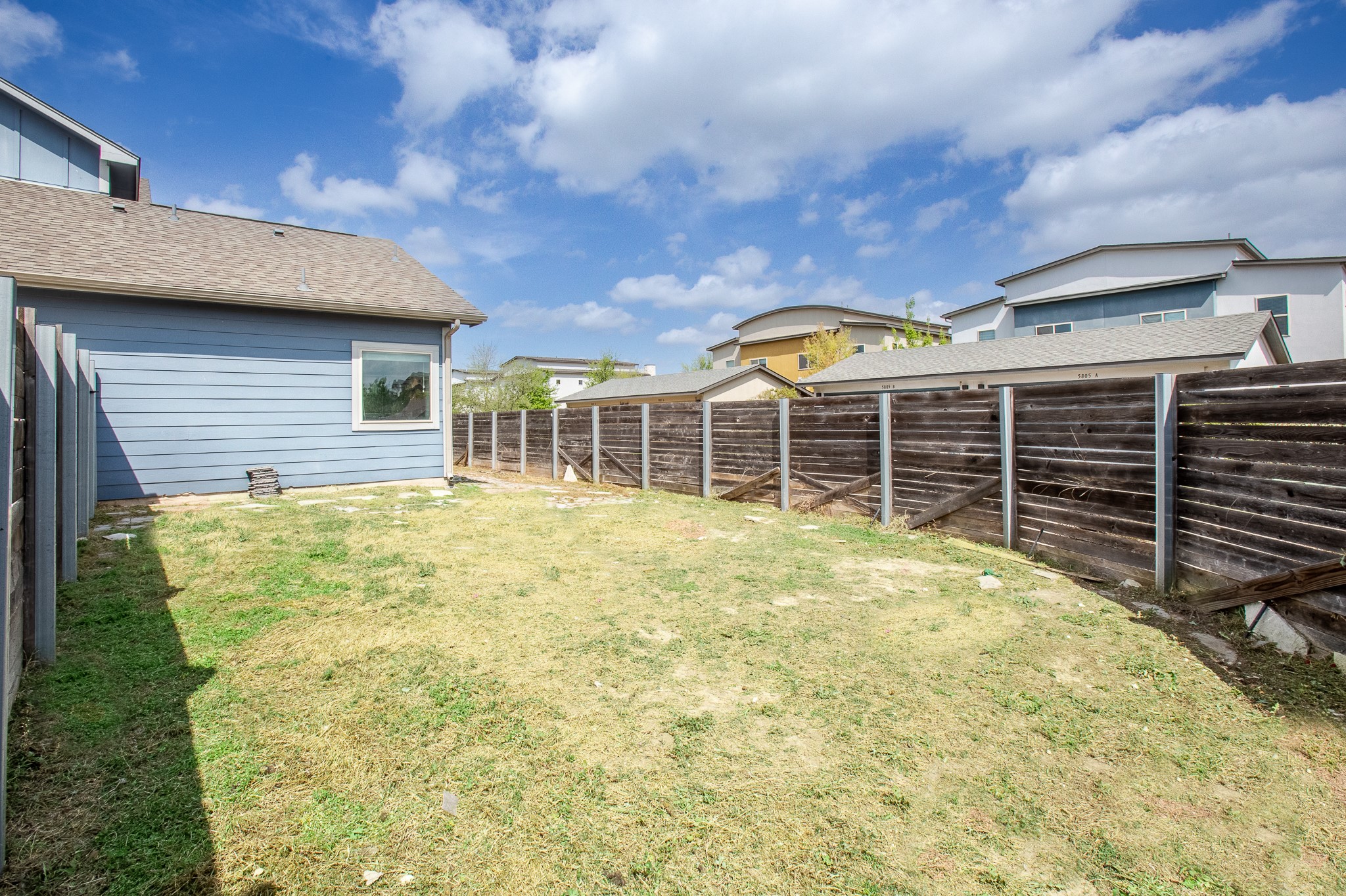 8709 Slater Drive Austin, TX 78747 - Photo 36 of 36 a view of a house with a yard and wooden fence