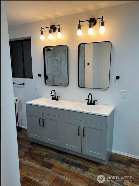 1412 Centralia Alpha Road Chehalis, WA 98532 - Photo 21 of 37 a bathroom with a double vanity sink and mirror