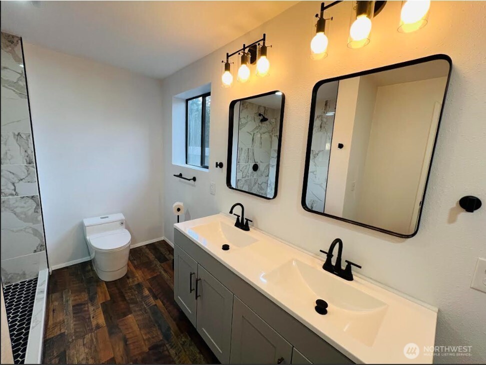 1412 Centralia Alpha Road Chehalis, WA 98532 - Photo 23 of 37 a bathroom with a sink and mirror with toilet