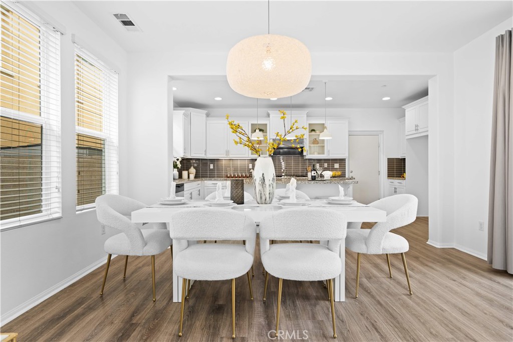 145 Mongoose Irvine, CA 92618 - Photo 11 of 37 a view of a dining room with furniture and wooden floor