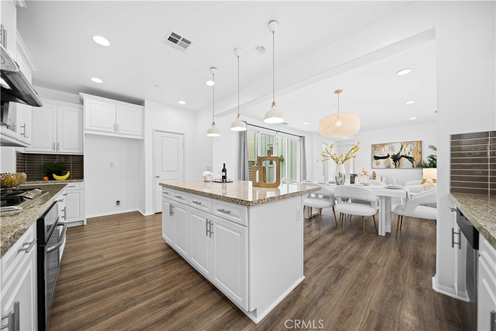 145 Mongoose Irvine, CA 92618 - Photo 15 of 37 a kitchen with white cabinets and sink