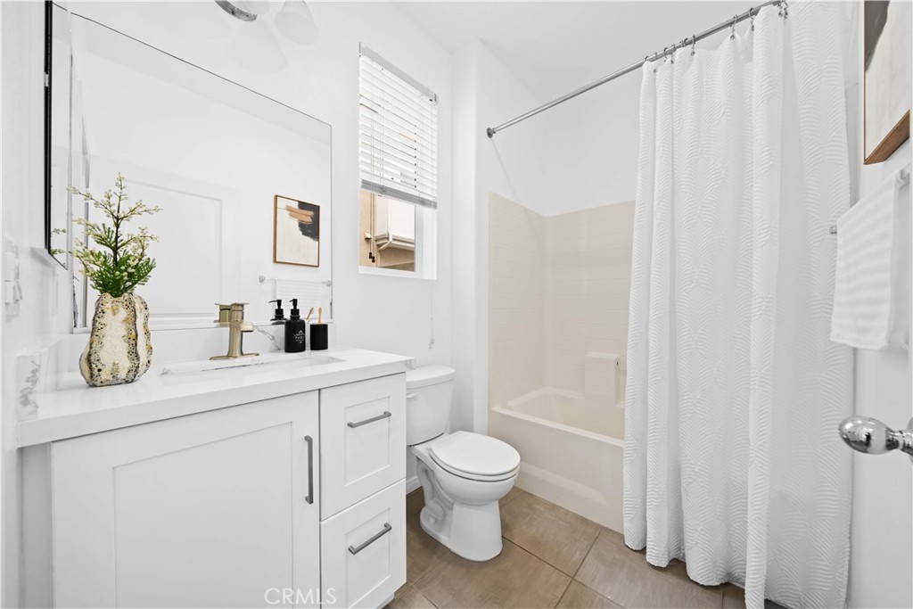145 Mongoose Irvine, CA 92618 - Photo 18 of 37 a bathroom with a toilet a sink and a window