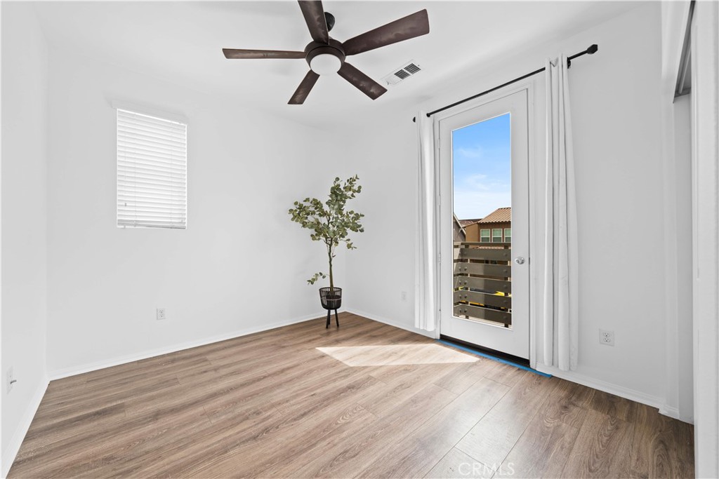 145 Mongoose Irvine, CA 92618 - Photo 20 of 37 an empty room with wooden floor closet and windows