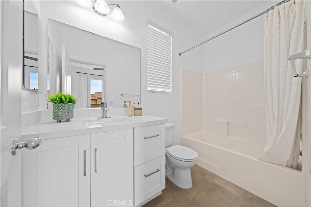 145 Mongoose Irvine, CA 92618 - Photo 22 of 37 a bathroom with a sink a toilet and shower