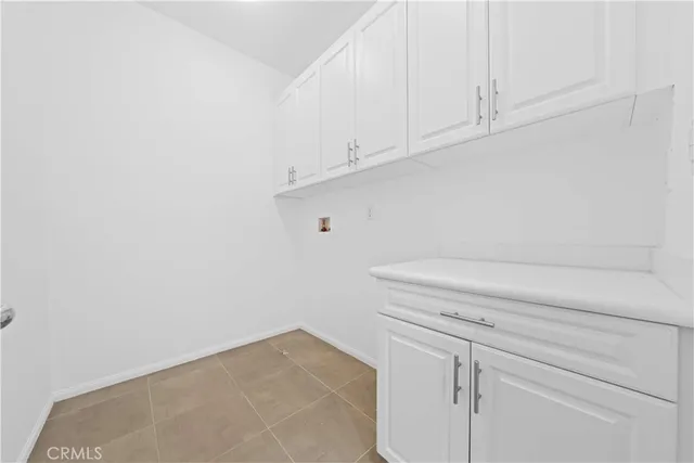 a spacious bedroom with a bed furniture and a window