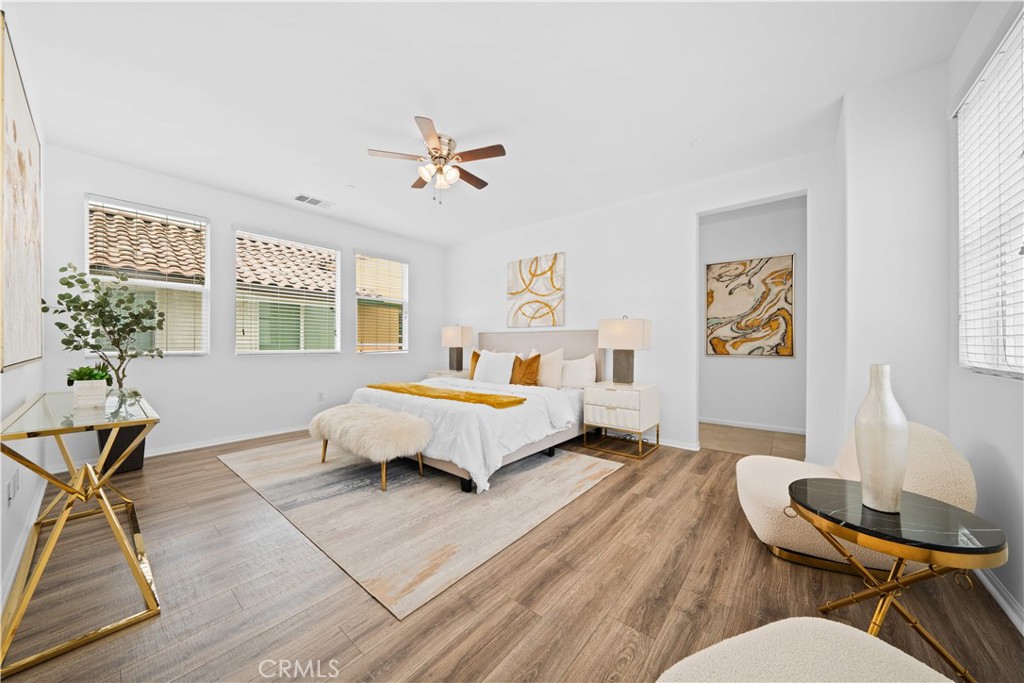 145 Mongoose Irvine, CA 92618 - Photo 24 of 37 a spacious bedroom with a bed furniture and a window