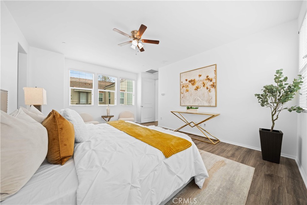 145 Mongoose Irvine, CA 92618 - Photo 26 of 37 a bedroom with a bed and a potted plant