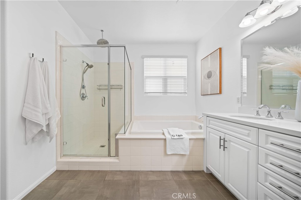 145 Mongoose Irvine, CA 92618 - Photo 32 of 37 a bathroom with a sink a toilet and shower