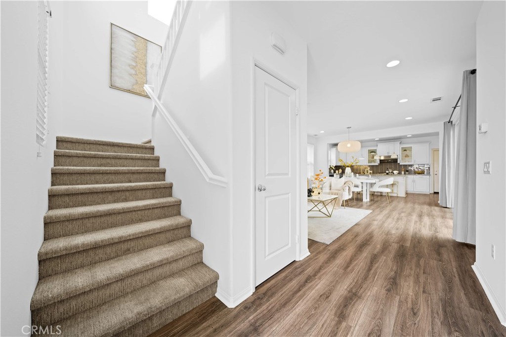 145 Mongoose Irvine, CA 92618 - Photo 4 of 37 a view of entryway and hall with wooden floor